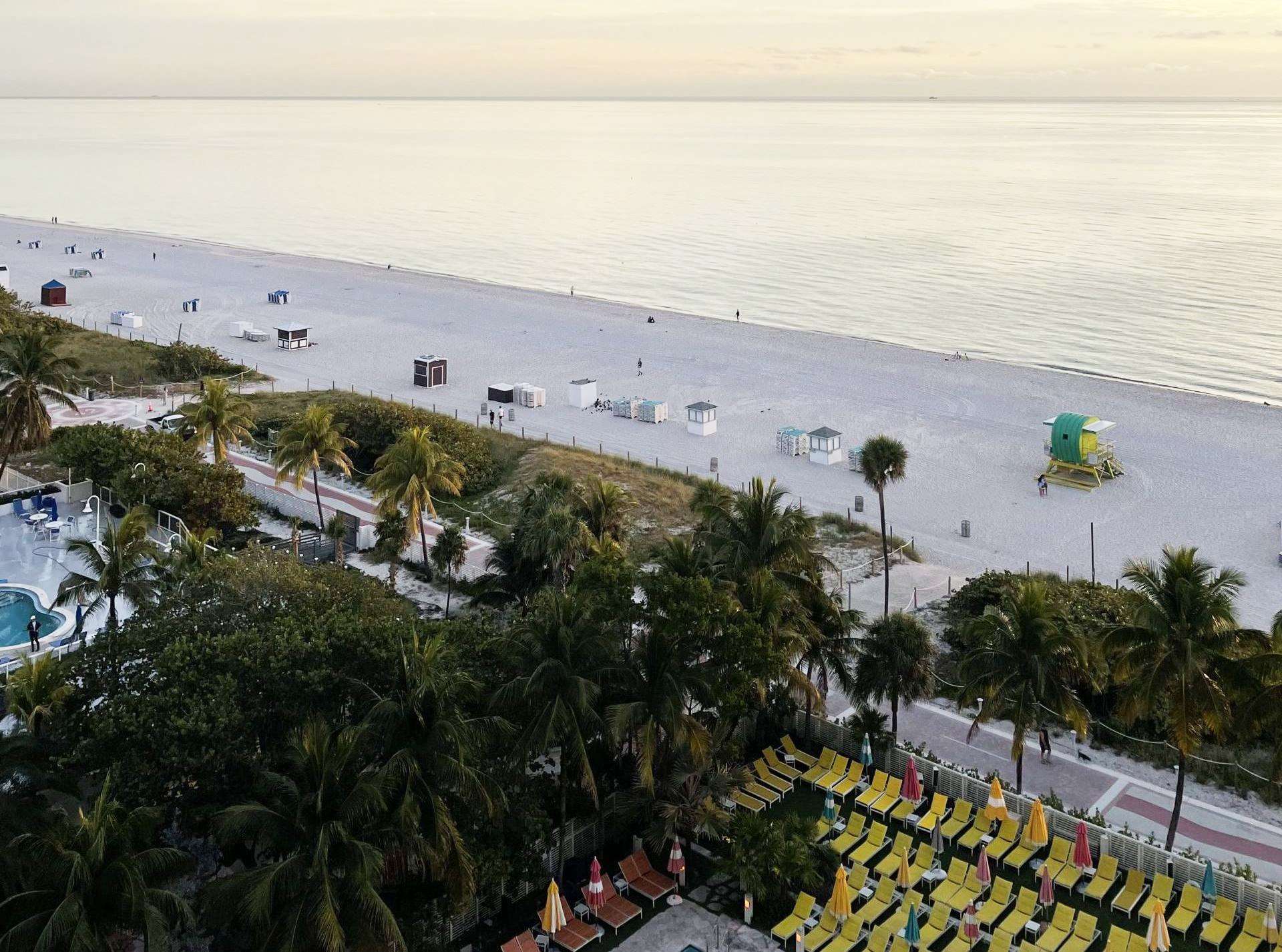 Miami Beach shoreline and ocean beneath a pale blue sky